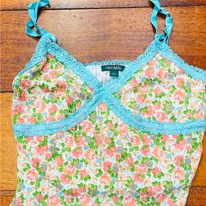 Low cut and cropped camisole.